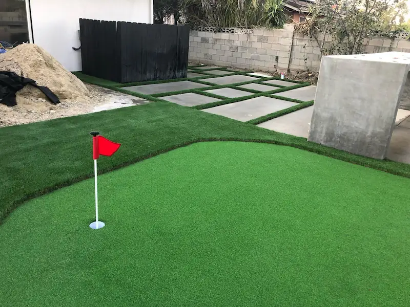 Custom backyard putting green installation